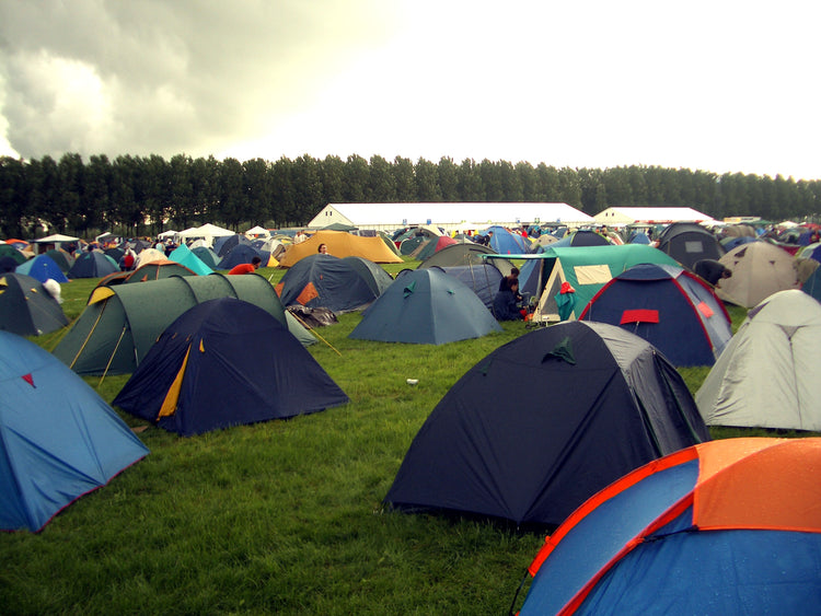 Rows of tents at a music festival campsite